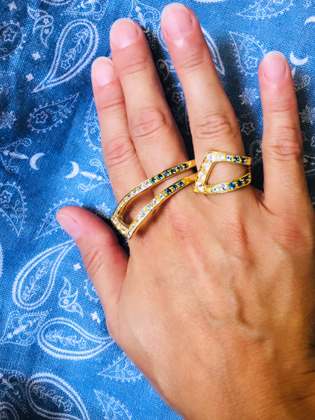 Gold sculptural cocktail ring with blue and white topaz from Atelier ORMAN