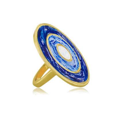 Gold round cocktail ring with blue marbled enamel work from Atelier ORMAN