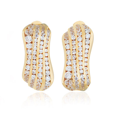 Gold sculptural earrings with diamonds from Atelier ORMAN