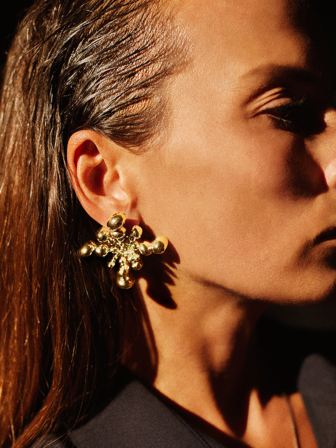 Gold statement earrings from Atelier ORMAN